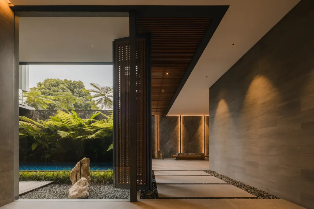 AW Residence — Courtyard view through the screen doors